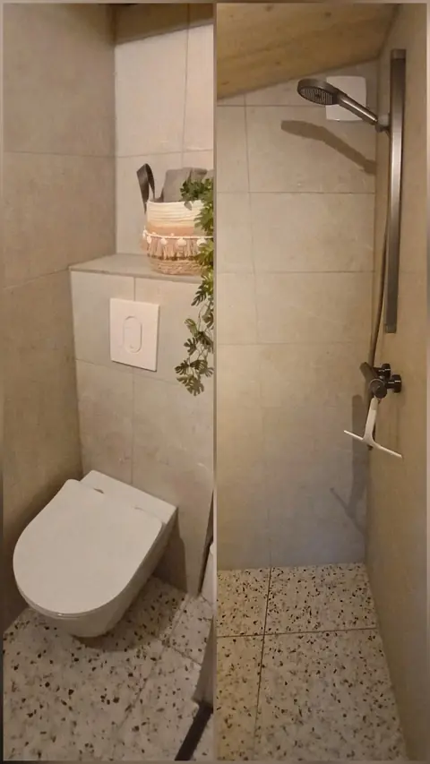 Badkamer met inloopdouche en toilet in De Appel