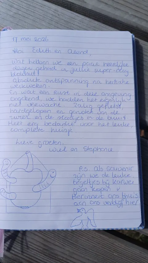 Handgeschreven bericht met tekening in het gastenboek